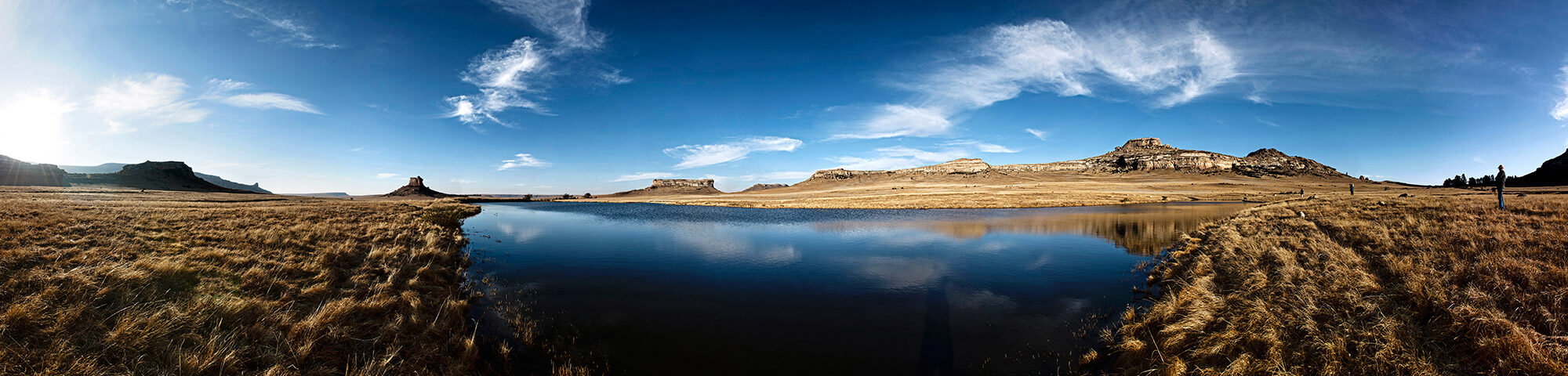 Lanscape view of Free State Nature Reserve dam and mountains in bakground