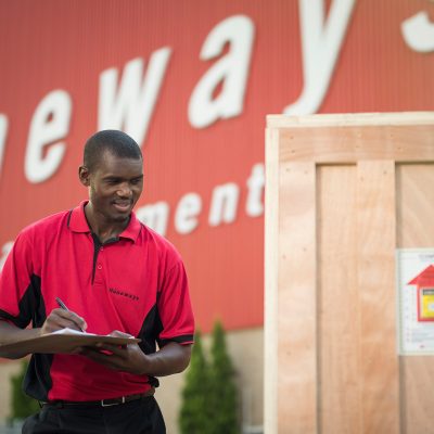 Heneways Movement employee marking off freight