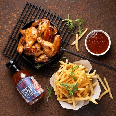 chicken wings and fries served with sauce