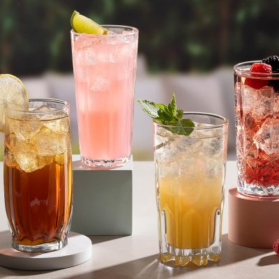 cocktails in four different styles of tumblers