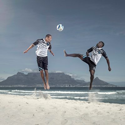 Football on Beach Action Shot. Stunning Action Photography by Ben Bergh Professional SA Photographer for Investec