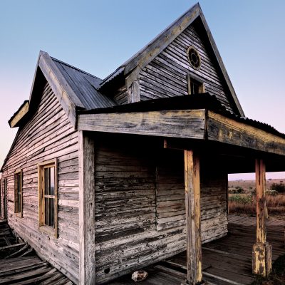 Rustic cabin in a field
