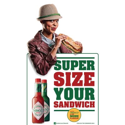 Tabasco advertisement with woman holding sub-sandwich