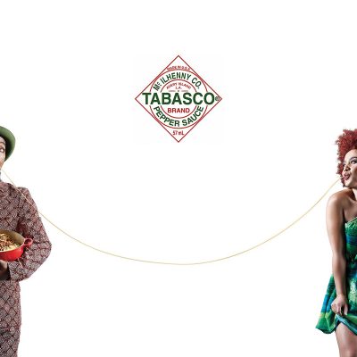 Tabasco advertisment of man and woman on opposite sides sharing long spaghetti string